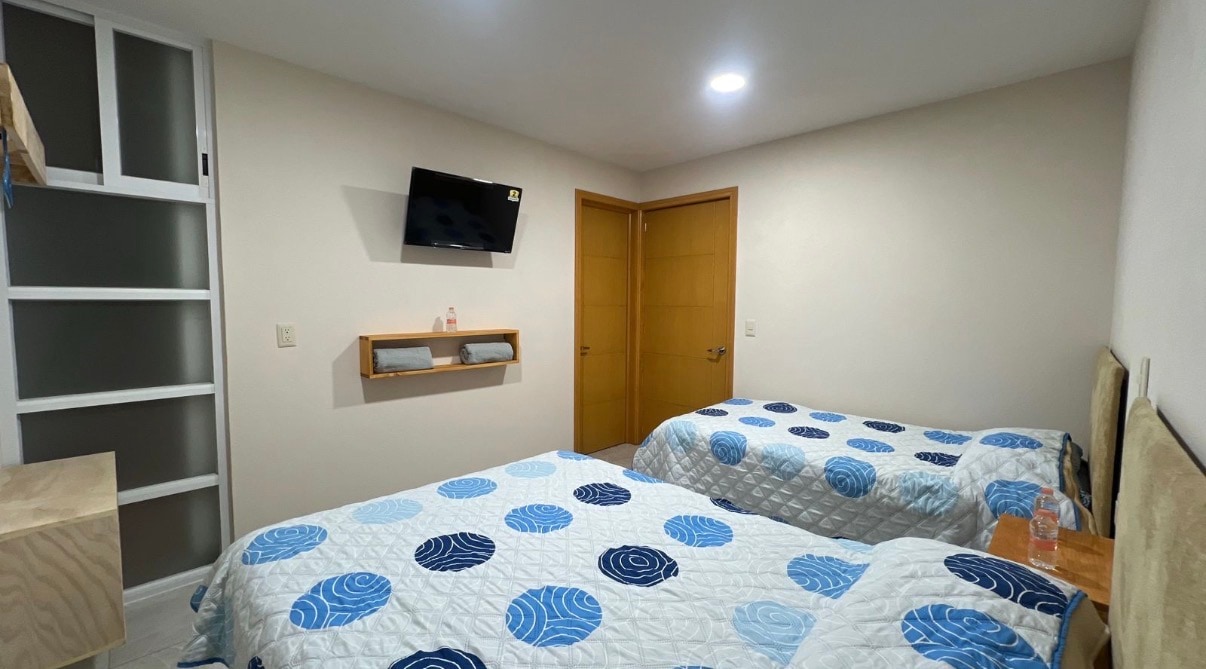 Habitación Triple con configuración para tres huéspedes.